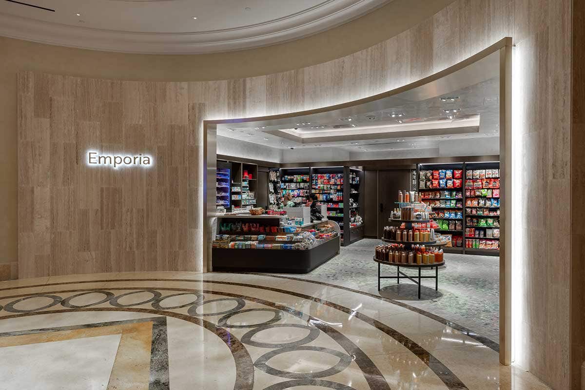 An open storefront with snacks and sundry products inside.